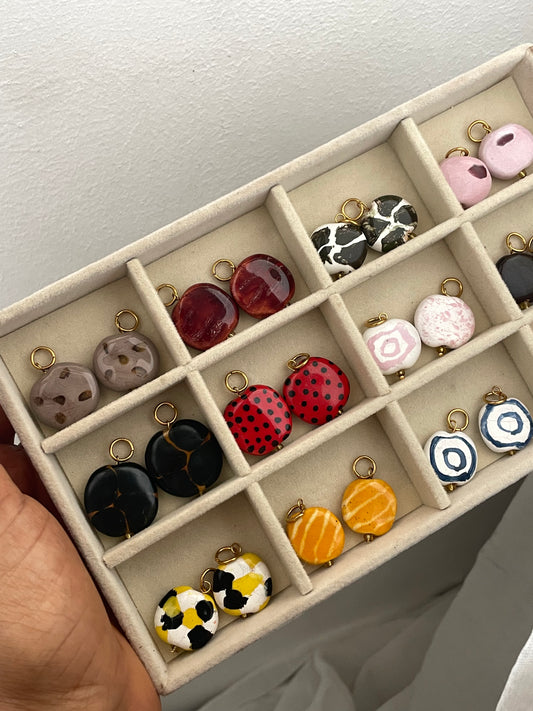 Hand formed Kazuri bead charms